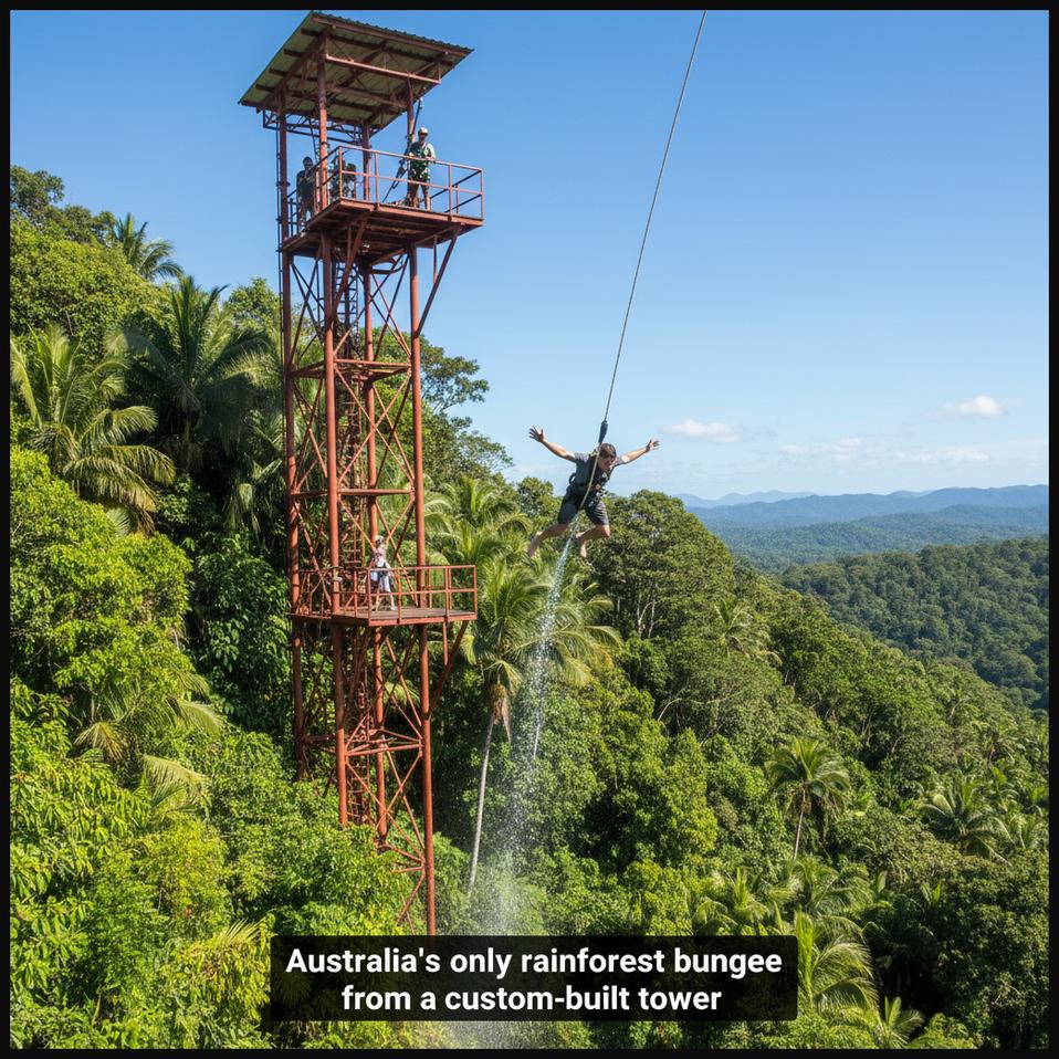 A bungee jumper launching from a purpose-built tower at AJ Hackett Cairns, Australia, surrounded by lush tropical rainforest foliage.